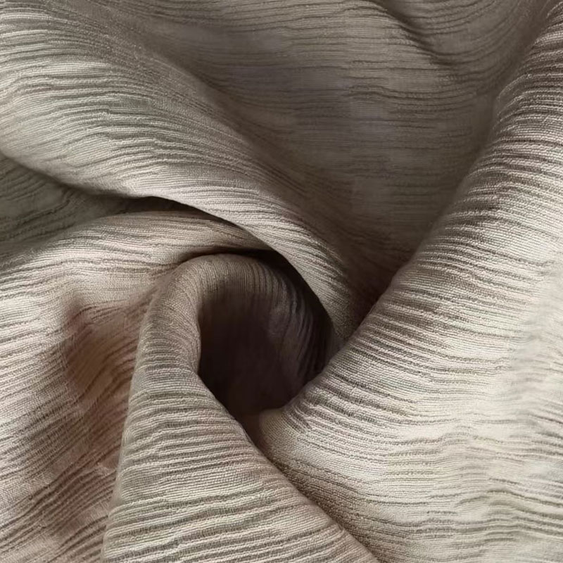 Jacquard-single-filament-nylon-rayon-kangas, jossa on selkeä laskostettu rakenne